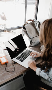 website designer working on a web design on a laptop